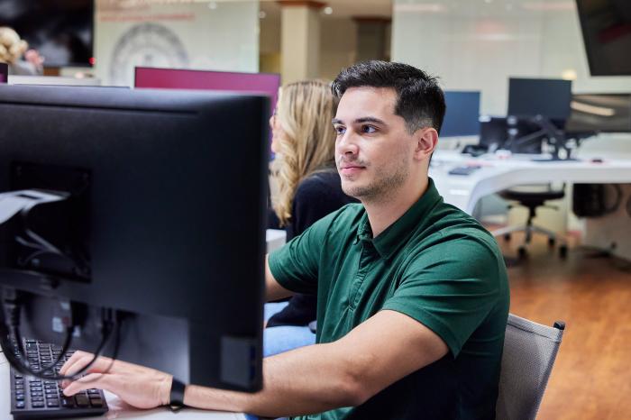 Student at computer in library
